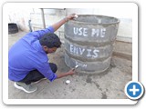 Dr. G. Karunasagaran, Scientist-D, ENVIS Centre distributing waste bin to village peoples 